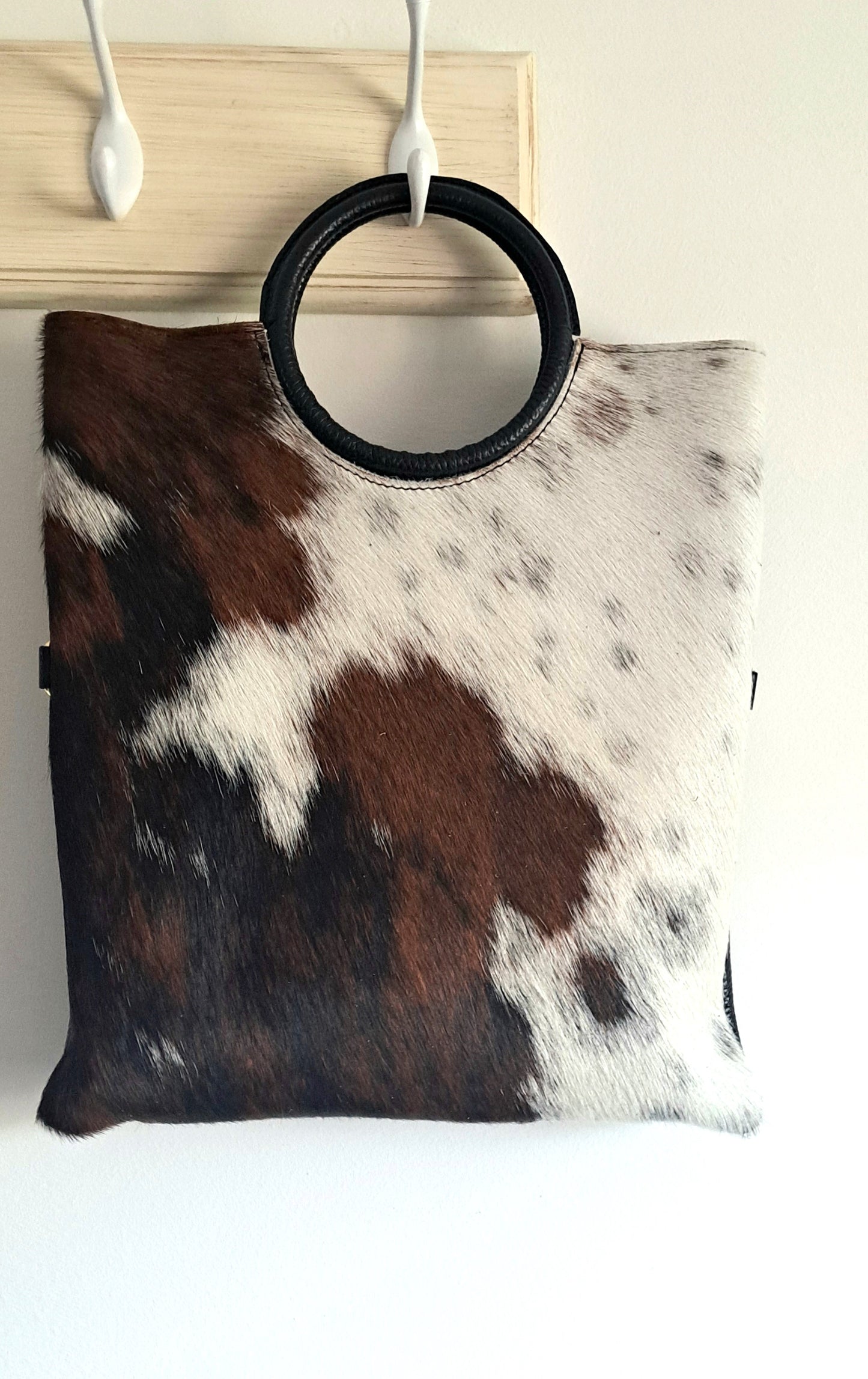 Convertible handbag into animal print shoulder bag